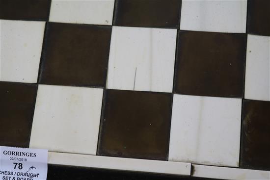 A 1930s ivory and tortoiseshell chess board and a 19th century ivory chess and draughts sets